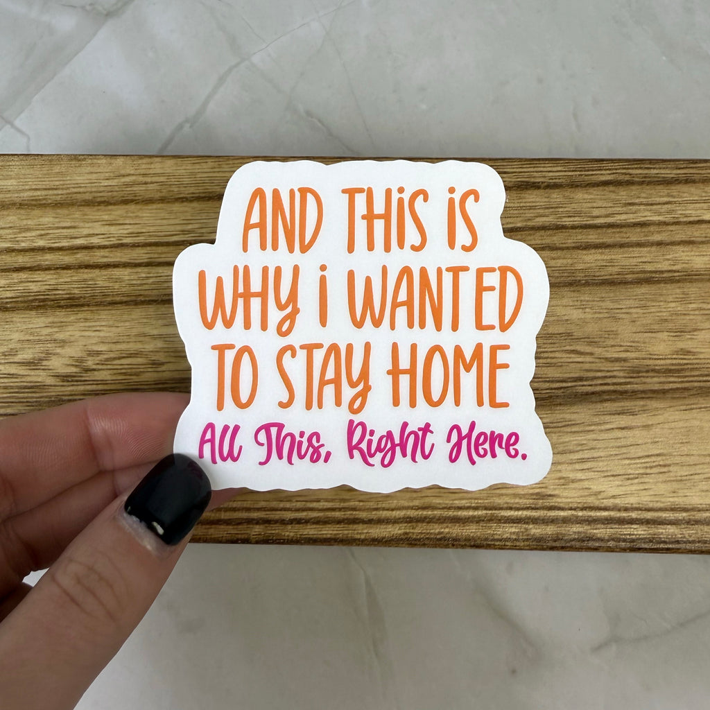 Sticker with text held over a wooden surface