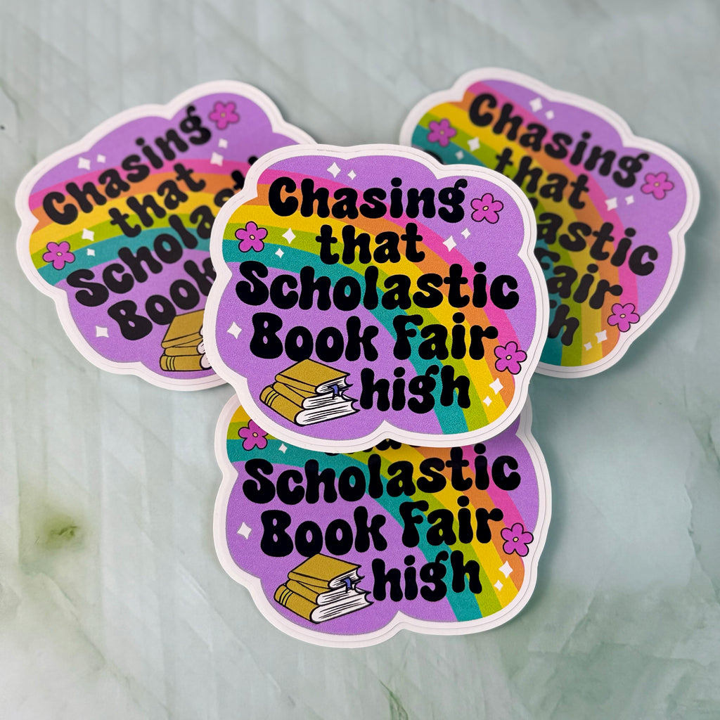 Three colorful stickers with text 'Chasing that Scholastic Book Fair high' on a light gray background.
