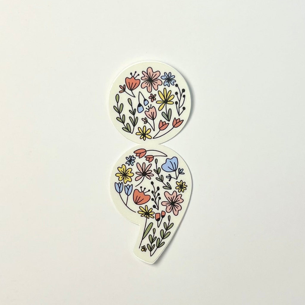 Two floral teardrop-shaped stickers on a light gray background