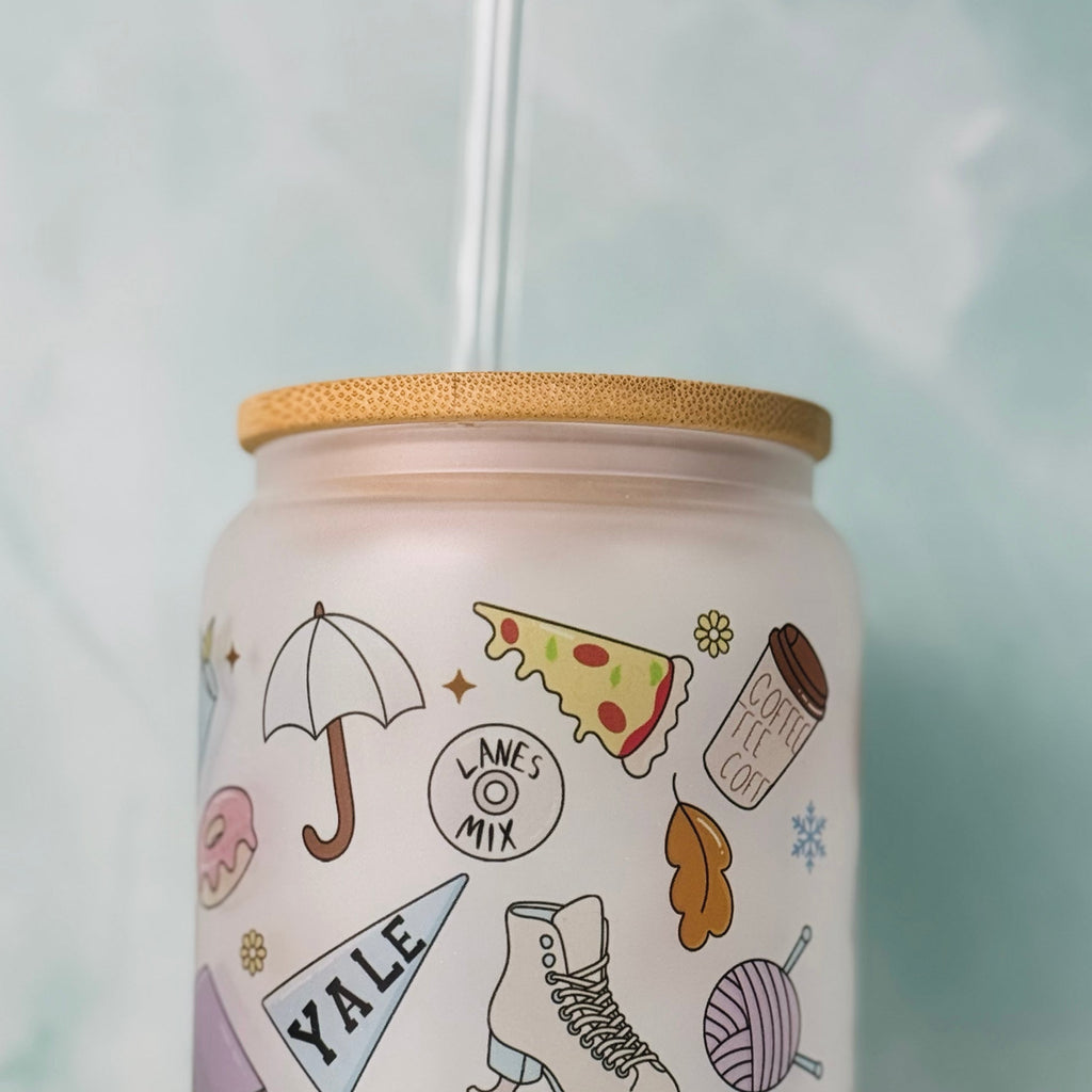 Tumbler with various illustrations and 'Yale' text on a light background