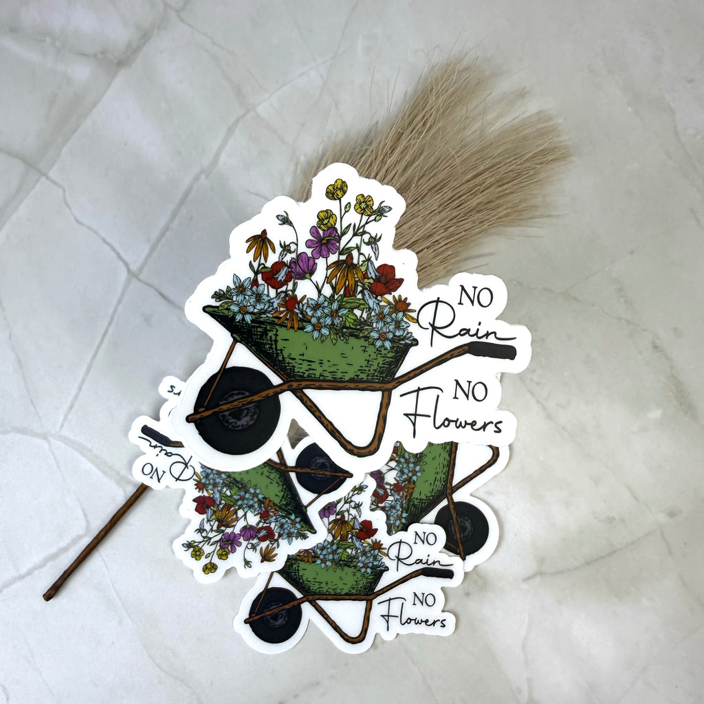 Sticker with wheelbarrow and flowers design on a textured white background